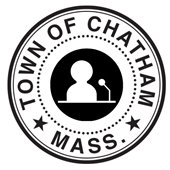 Town seal with the silhouette of a speaker at a podium in the center