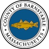 Gold codfish in a blue circle with Barnstable County Massachusetts around it