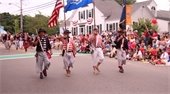 Men dressed as pirates marching down a street