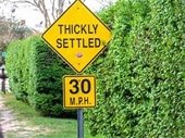 Yellow "Thickly Settled" sign