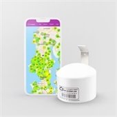 Small white Air Sensor next to a cell phone displaying a map of air sensor data