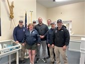 Marshall Burke center with members of the Harbormaster's staff