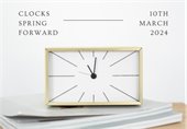 Elegant clock on white background with a reminder to set clocks ahead one hour on March 10th