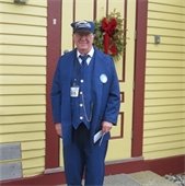 Man dressed as a Train Conductor standing outside the Chatham Railroad Museum