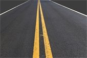 Double yellow line on black asphalt