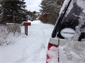 Vehicle with a "Chatham" window decal parked on a snowy street