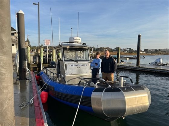 Xander Foresman and Harbormaster Jason Holm on the H271 boat