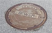 Manhole Cover with Chatham Sewer imprinted on it
