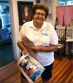 Barbara Burgo in a white shirt smiling