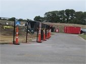 black wire fencing and traffic cones around a construction site