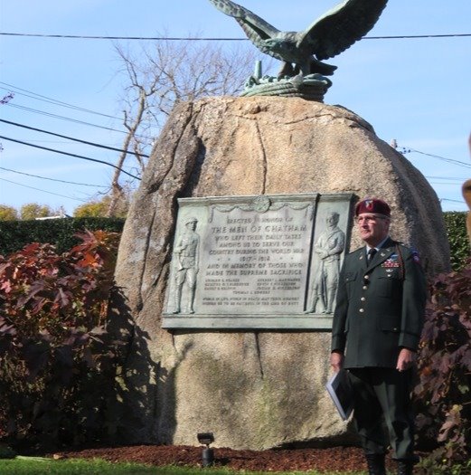Rob Franz in uniform standing beside the World War I Memorial