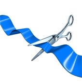 Silver scissors cutting a blue ribbon