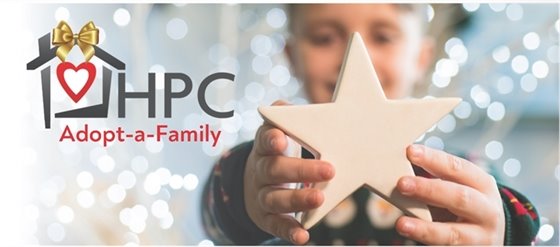 Child holding a star with the Homeless Prevention Council's logo beside them