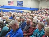 Annual Town Meeting voters in the Middle School Gym