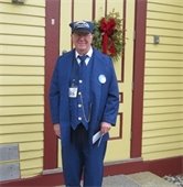 Man dressed as Train Conductor standing outside the Chatham Railroad Museum