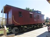 Red caboose located behind the Chatham Railroad Museum.