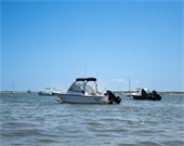 Small motorboats moored in a bay