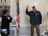 Town Clerk Julie Smith swearing in Jackson Goddard.