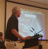 Ted Keon standing at a podium in profile