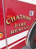 Chatham Fire Truck door with reflection of turnout gear