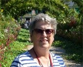 Cathy Weston standing in a garden on a sunny day