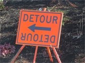 Square Orange sign with Detour in black with black arrows