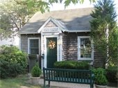 South Chatham Public Library front door with drop box and bench