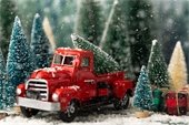 Red toy truck with Christmas tree in the back