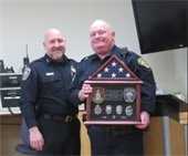 Police Chief Mike Anderson and retiring Officer John Whittle